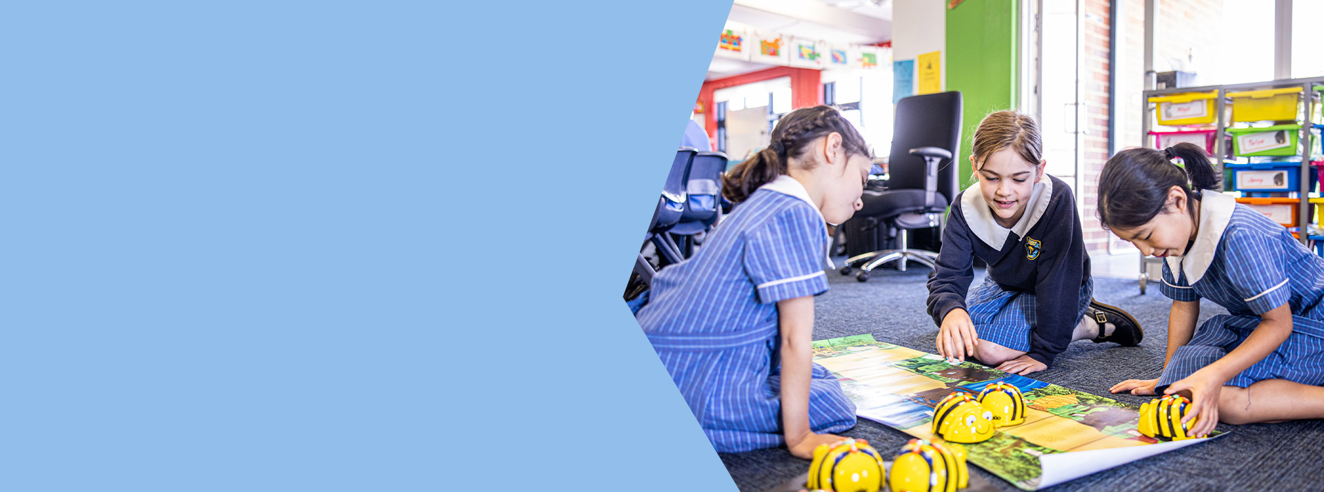 Students programming bee bots in the classroom at St Mary's Primary School Rydalmere