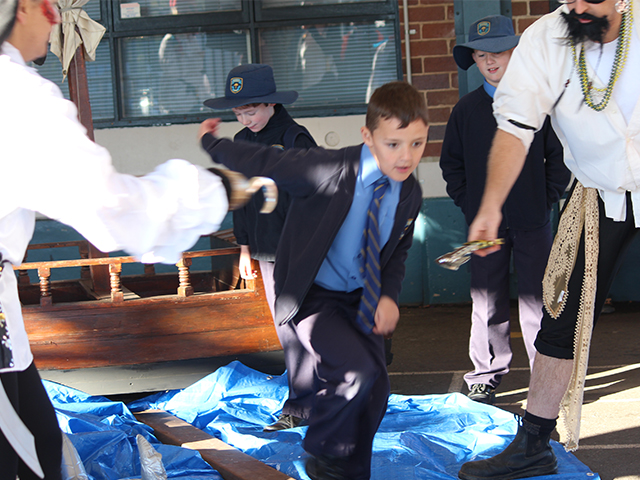 A student enters the school by walking the plank!