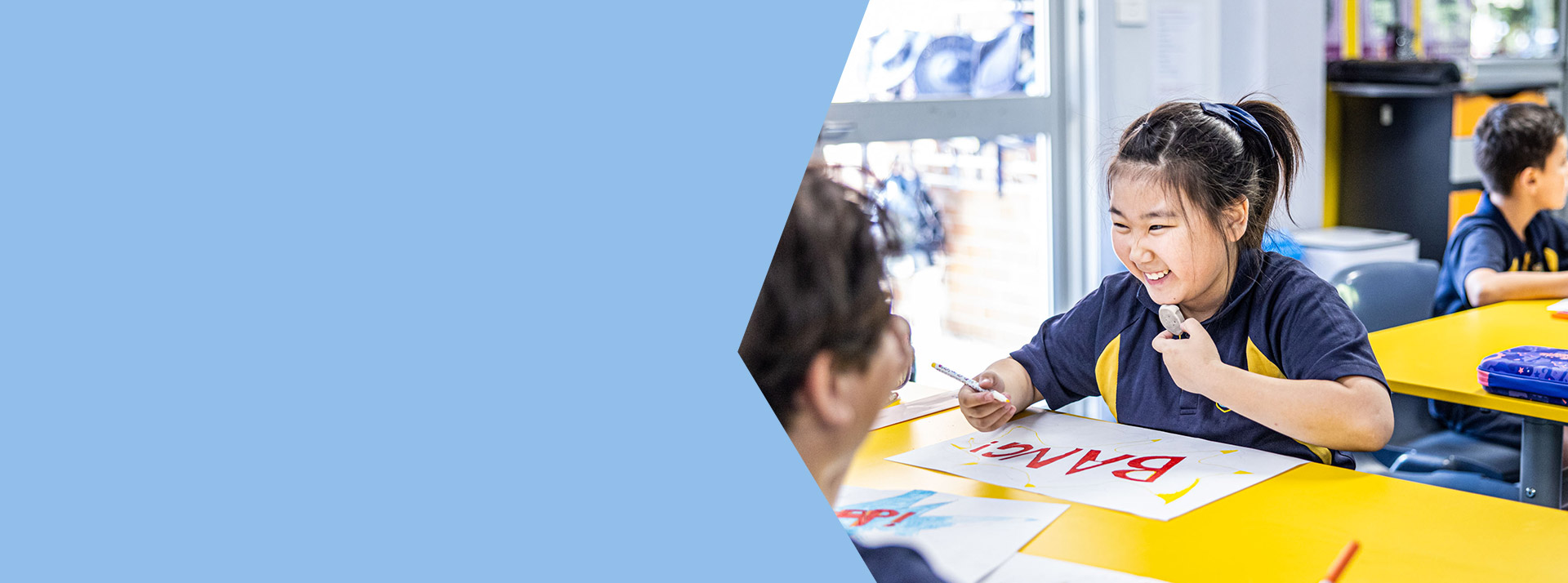Student painting in the classroom at St Mary's Primary School Rydalmere