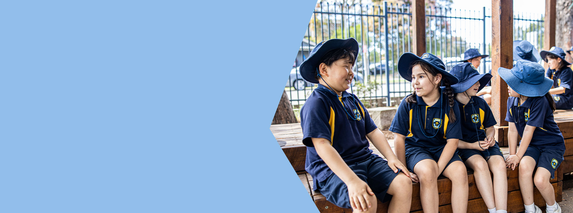 Students sitting together in the playground at St Mary's Primary School Rydalmere
