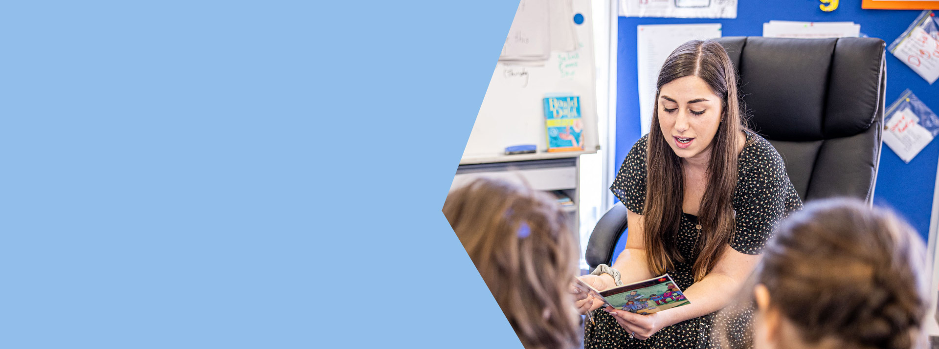 Teacher reading to her students in the classroom at St Mary's Primary School Rydalmere