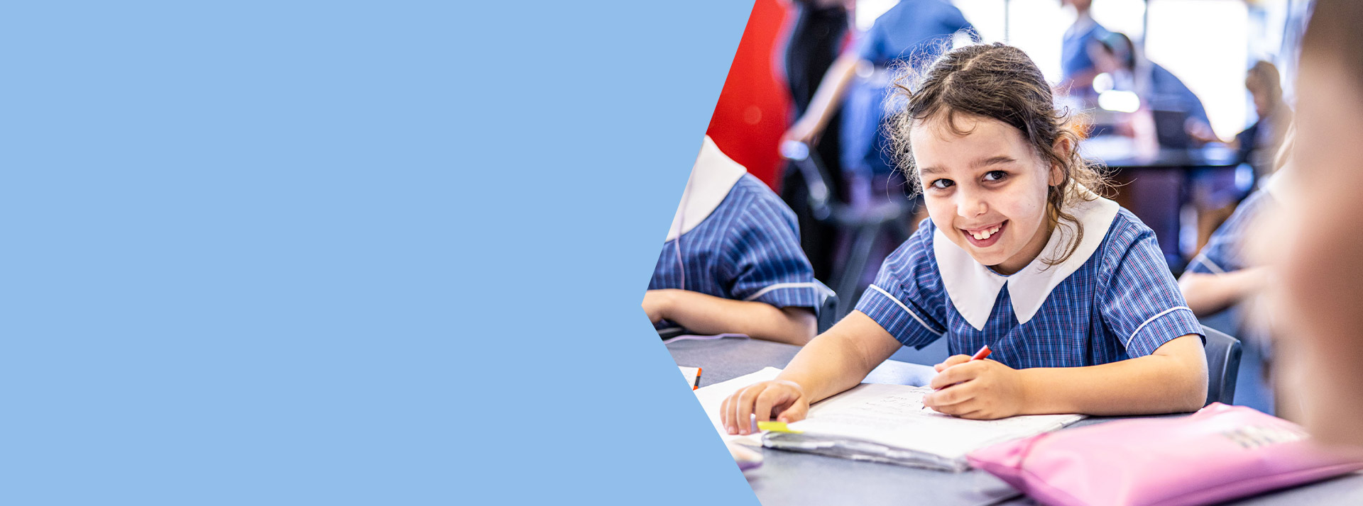 Student smiling in the classroom at St Mary's Primary School Rydalmere