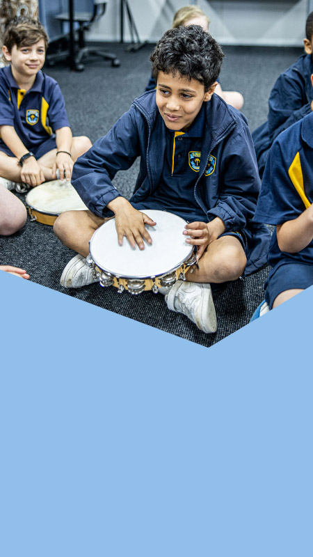 Students playing instruments in the classroom at St Mary's Primary School Rydalmere