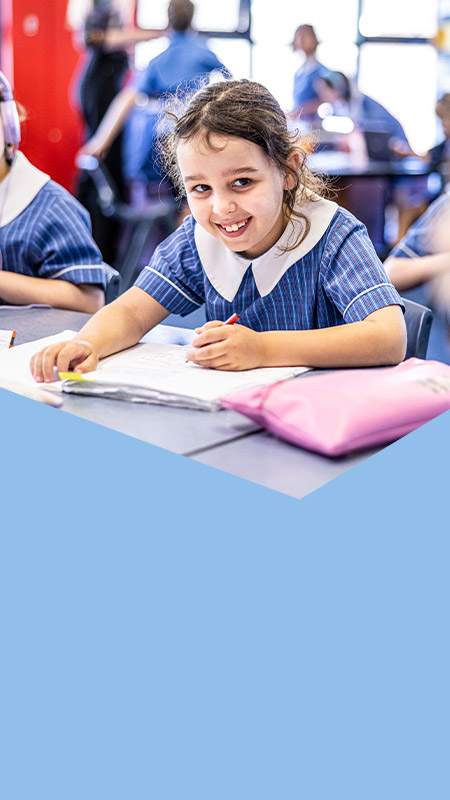 Student smiling in the classroom at St Mary's Primary School Rydalmere
