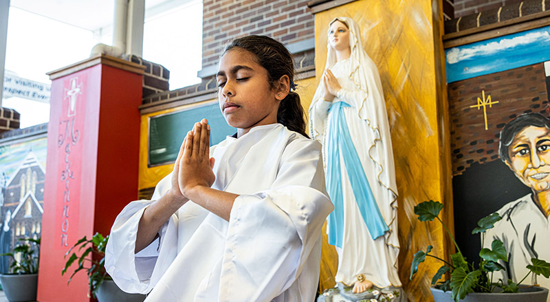 Student performing in a liturgy at St Mary's Primary School Rydalmere