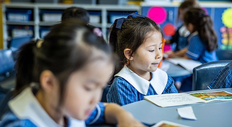 Students reading in the classroom at St Mary's Primary School Rydalmere