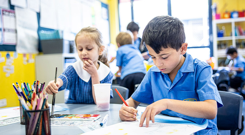 Students drawing together in the classroom at St Mary's Primary School Rydalmere