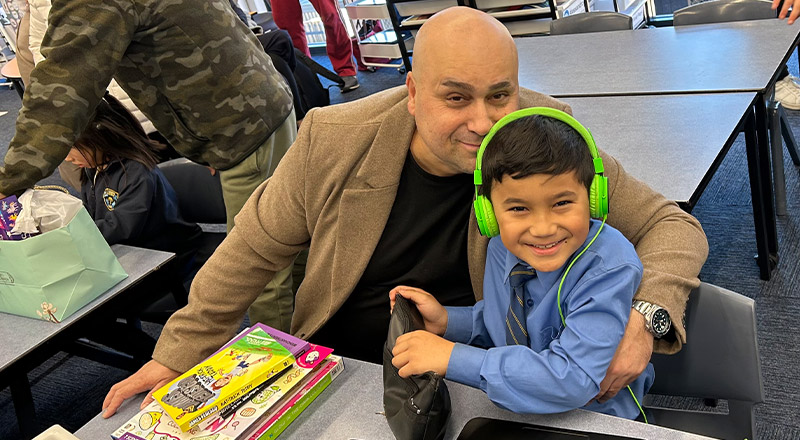 Student with his son at a school event at St Mary's Primary School Rydalmere
