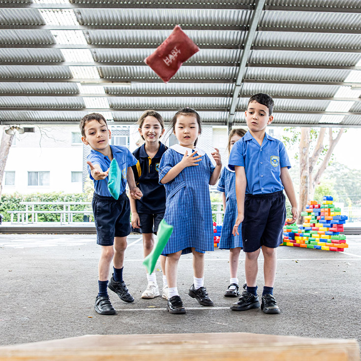 Students playing outside in the playground together at St Mary's Primary School Rydalmere