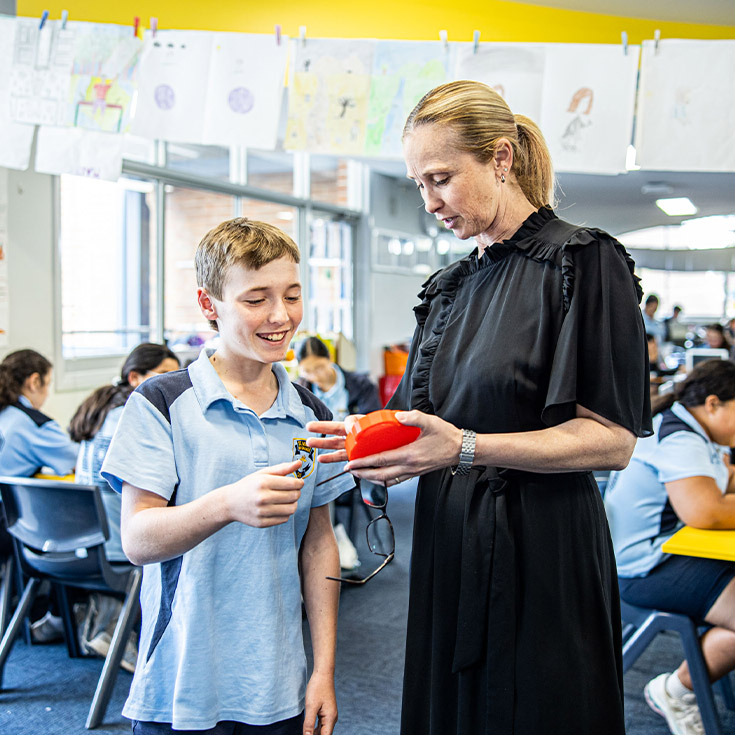 Teacher with her student in the classroom at St Mary's Primary School Rydalmere