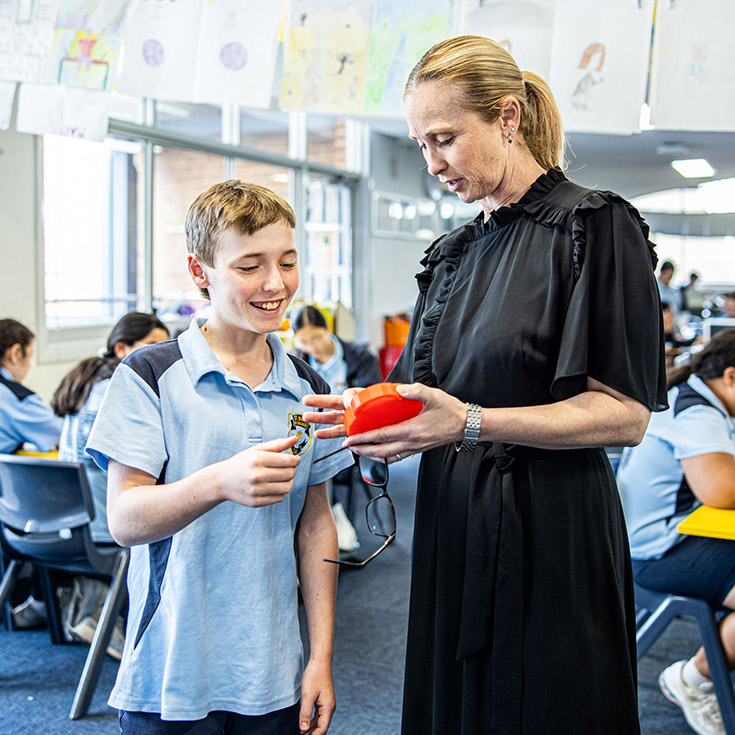 Teacher with her student in the classroom at St Mary's Primary School Rydalmere