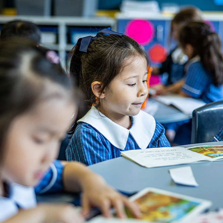Students reading in the classroom at St Mary's Primary School Rydalmere